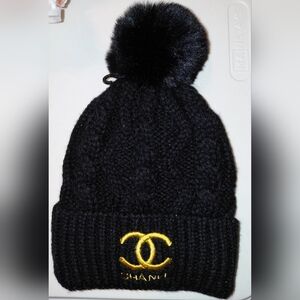 CHANEL Black Knit Beanie with Gold Logo